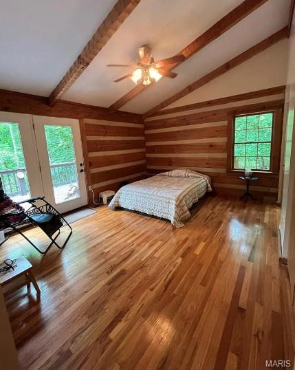 16453 Scenic Ridge Rd, Marthasville, MO 63357 - bedroom with access to exterior, multiple windows, wood finished floors, a ceiling fan, and wooden walls