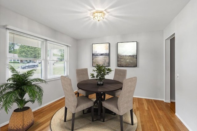 13105 Dartagnan Ct, Creve Coeur, MO 63141 - dining space featuring light wood-style floors and baseboards