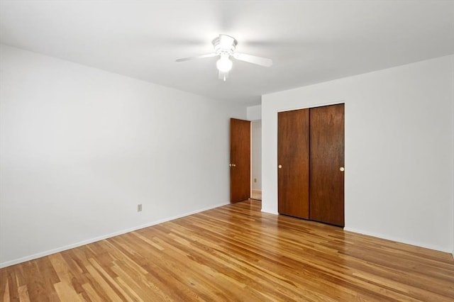 13105 Dartagnan Ct, Creve Coeur, MO 63141 - unfurnished bedroom featuring light wood-style floors, a closet, ceiling fan, and baseboards