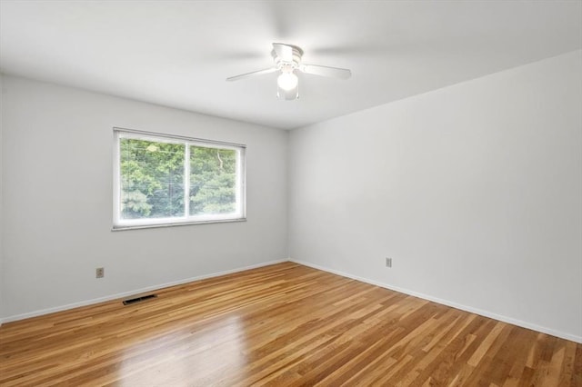 13105 Dartagnan Ct, Creve Coeur, MO 63141 - empty room featuring light wood-style floors, baseboards, and a ceiling fan