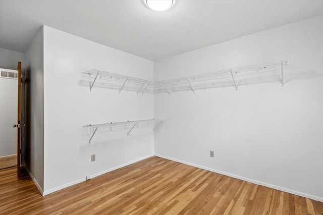 13105 Dartagnan Ct, Creve Coeur, MO 63141 - spacious closet featuring wood finished floors