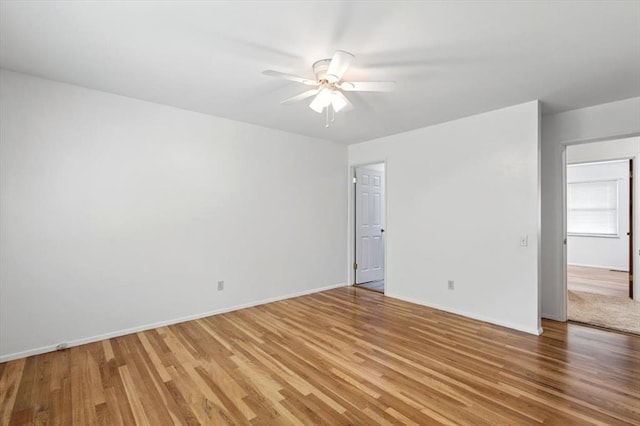13105 Dartagnan Ct, Creve Coeur, MO 63141 - empty room with light wood-type flooring, a ceiling fan, and baseboards