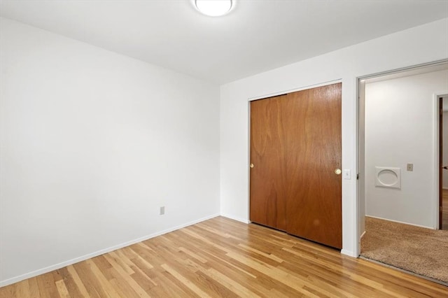 13105 Dartagnan Ct, Creve Coeur, MO 63141 - unfurnished bedroom with light wood-style floors, a closet, and baseboards