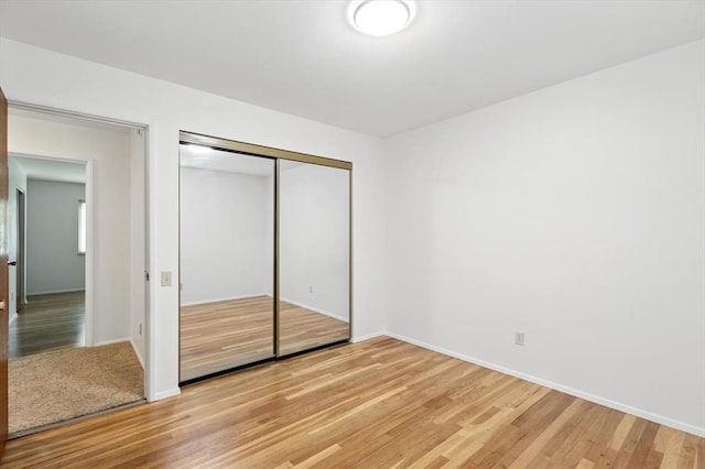 13105 Dartagnan Ct, Creve Coeur, MO 63141 - unfurnished bedroom with light wood-style floors, baseboards, and a closet