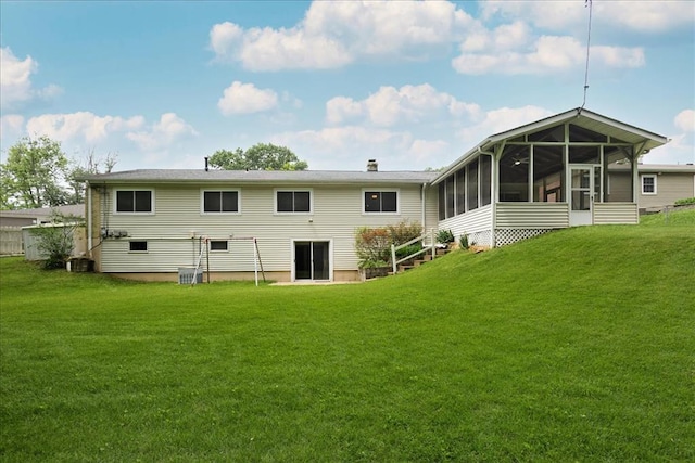 13105 Dartagnan Ct, Creve Coeur, MO 63141 - back of house featuring a sunroom, a lawn, and central AC
