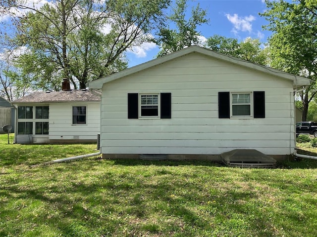 21734 Keyesport Rd, Carlyle, IL 62253 - rear view of property featuring a yard, a sunroom, and a chimney