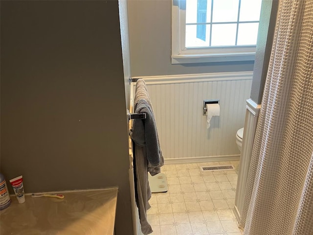 21734 Keyesport Rd, Carlyle, IL 62253 - bathroom with wainscoting, baseboards, and toilet