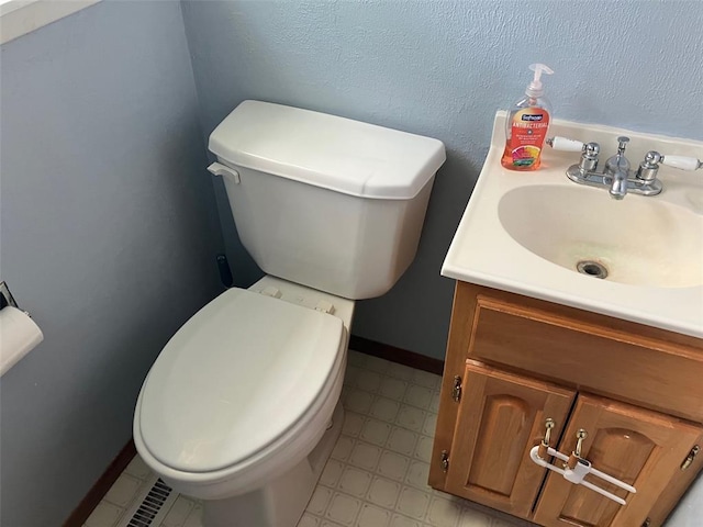 21734 Keyesport Rd, Carlyle, IL 62253 - bathroom featuring toilet, vanity, and tile patterned floors