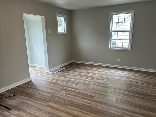 1910 E B St E, Belleville, IL 62221 - spare room with baseboards and wood finished floors