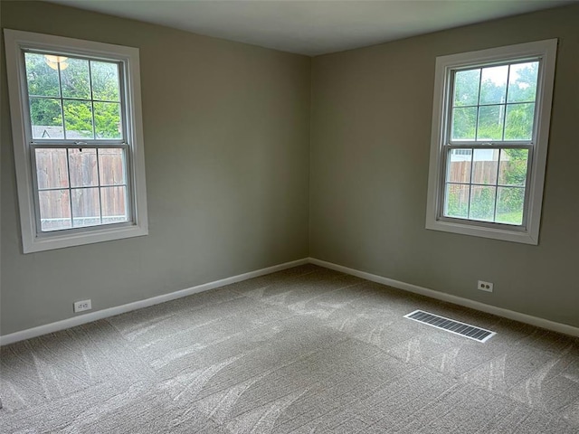 1910 E B St E, Belleville, IL 62221 - empty room with carpet floors, baseboards, and healthy amount of natural light