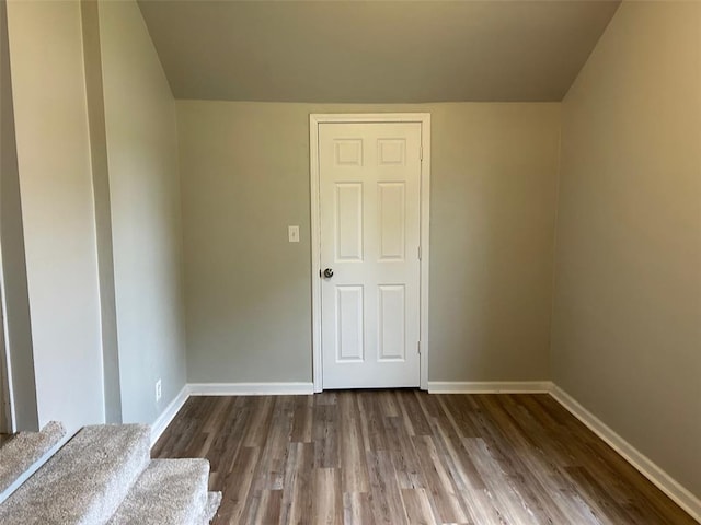 1910 E B St E, Belleville, IL 62221 - unfurnished room with baseboards, wood finished floors, and lofted ceiling