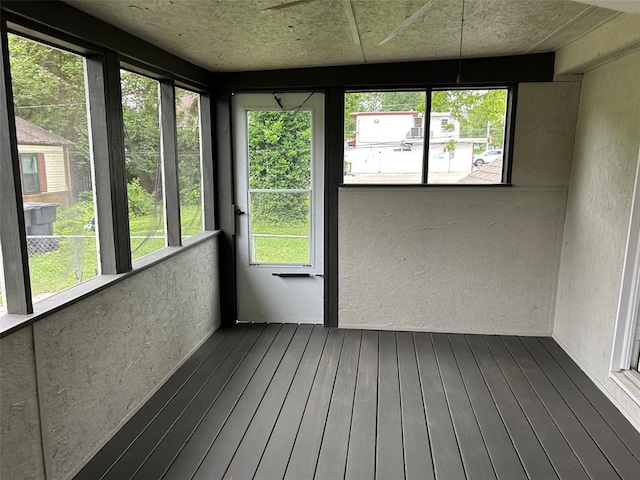 1910 E B St E, Belleville, IL 62221 - unfurnished sunroom featuring a textured wall and hardwood / wood-style floors