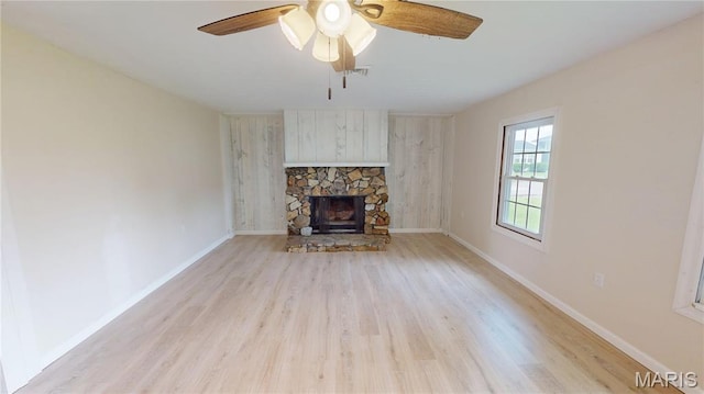 1350 Norwood Dr, Granite City, IL 62040 - unfurnished living room featuring light wood-style flooring, a ceiling fan, and a fireplace
