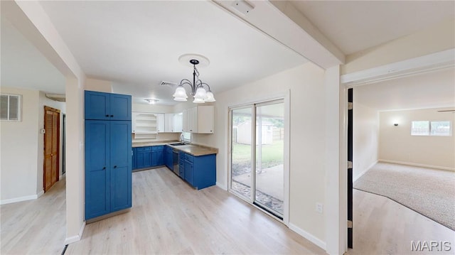1350 Norwood Dr, Granite City, IL 62040 - kitchen with blue cabinets, light wood finished floors, plenty of natural light, and a chandelier