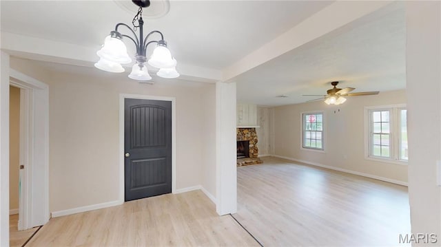 1350 Norwood Dr, Granite City, IL 62040 - foyer entrance with light wood-style floors, a chandelier, a fireplace, and a ceiling fan