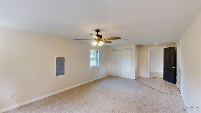 1350 Norwood Dr, Granite City, IL 62040 - unfurnished bedroom with light colored carpet, electric panel, a closet, and a ceiling fan