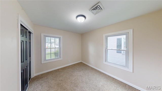 1350 Norwood Dr, Granite City, IL 62040 - unfurnished bedroom featuring light colored carpet and a closet