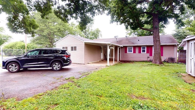 1350 Norwood Dr, Granite City, IL 62040 - ranch-style home featuring asphalt driveway and an attached carport