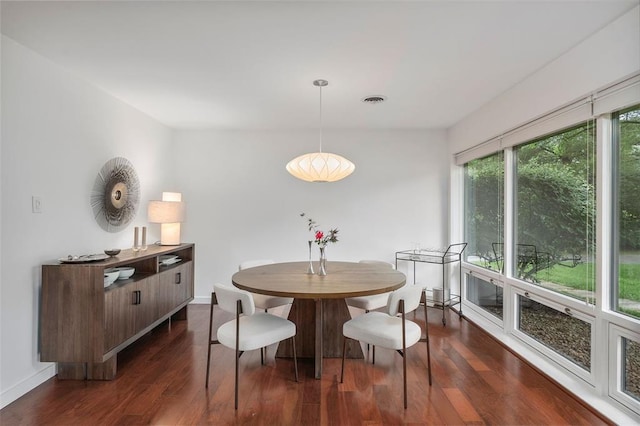 36 Stoneyside Ln, Olivette, MO 63132 - dining area with dark wood-style flooring and baseboards