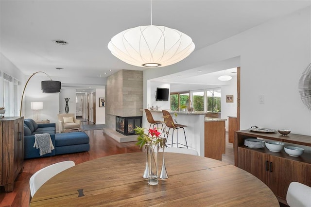 36 Stoneyside Ln, Olivette, MO 63132 - dining space featuring wood finished floors and a tile fireplace