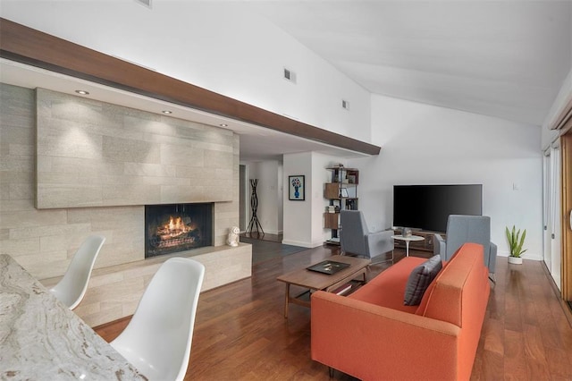 36 Stoneyside Ln, Olivette, MO 63132 - living room with wood finished floors, a tiled fireplace, a desk, high vaulted ceiling, and baseboards