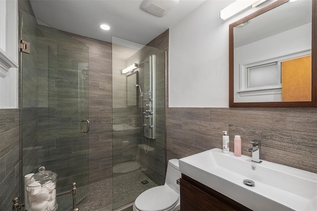 36 Stoneyside Ln, Olivette, MO 63132 - bathroom featuring vanity, tile walls, a stall shower, and toilet