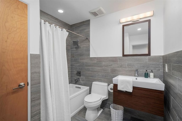 36 Stoneyside Ln, Olivette, MO 63132 - bathroom featuring tile walls, vanity, toilet, and shower / tub combo