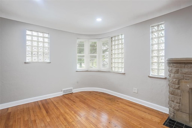 3210 Capehart Dr, Saint Louis, MO 63121 - empty room with light wood-type flooring, plenty of natural light, and baseboards