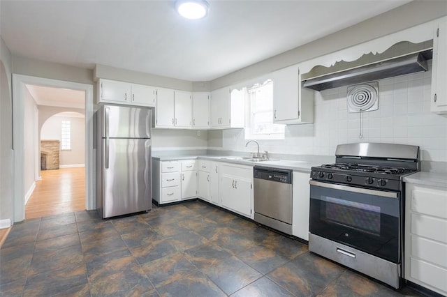 3210 Capehart Dr, Saint Louis, MO 63121 - kitchen with stainless steel appliances, a sink, light countertops, and white cabinetry
