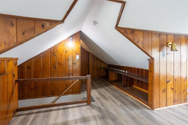 3210 Capehart Dr, Saint Louis, MO 63121 - bonus room with wooden walls, wood finished floors, and vaulted ceiling