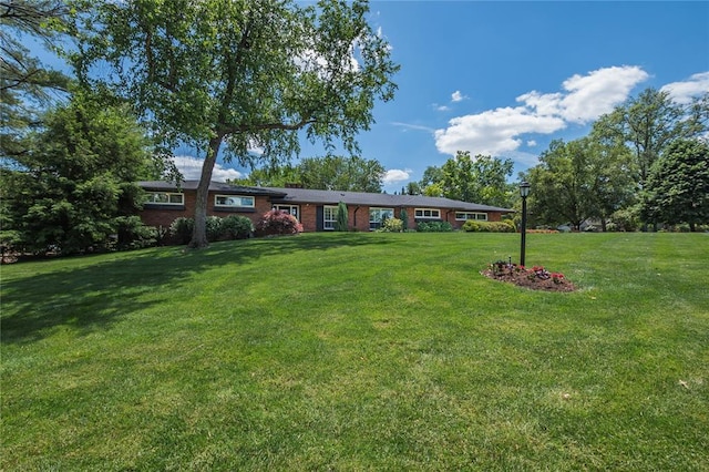 23 Vouga Ln, Frontenac, MO 63131 - view of front facade with a front lawn and brick siding