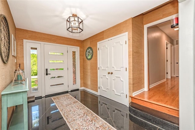 23 Vouga Ln, Frontenac, MO 63131 - foyer featuring baseboards, granite tiled floors, and a chandelier