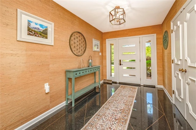 23 Vouga Ln, Frontenac, MO 63131 - foyer entrance featuring baseboards, granite floors, and a chandelier