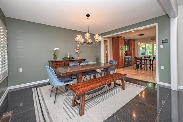 23 Vouga Ln, Frontenac, MO 63131 - dining area with a chandelier, baseboards, and granite floors