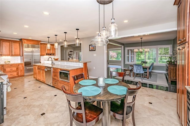 23 Vouga Ln, Frontenac, MO 63131 - dining room with recessed lighting, a chandelier, and baseboards