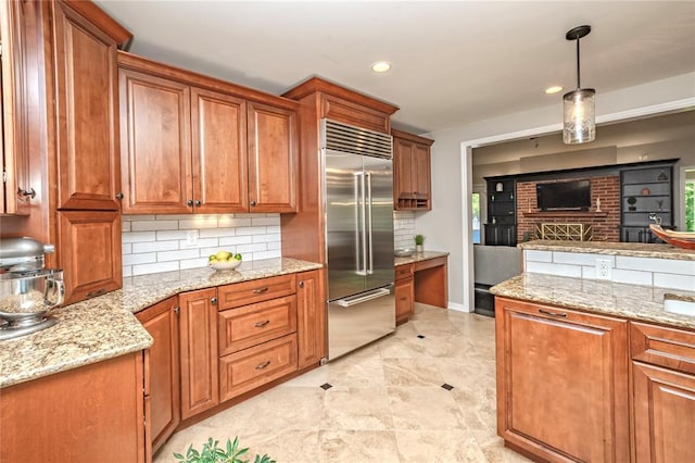 23 Vouga Ln, Frontenac, MO 63131 - kitchen featuring stainless steel built in refrigerator, brown cabinetry, decorative backsplash, and recessed lighting
