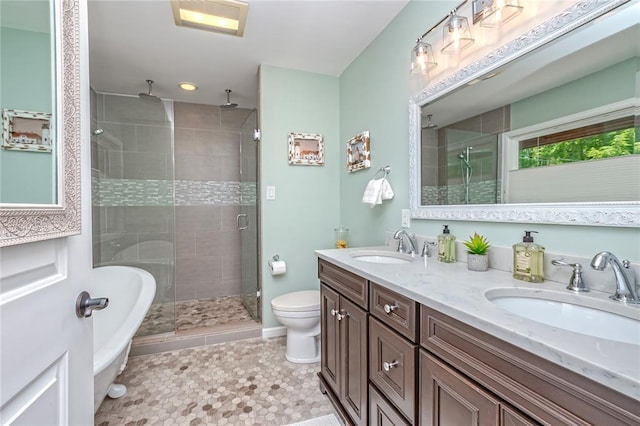 23 Vouga Ln, Frontenac, MO 63131 - bathroom with a stall shower, double vanity, a freestanding bath, and toilet