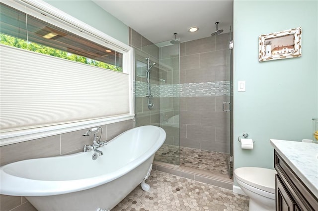 23 Vouga Ln, Frontenac, MO 63131 - bathroom featuring a shower stall, vanity, a freestanding tub, plenty of natural light, and recessed lighting