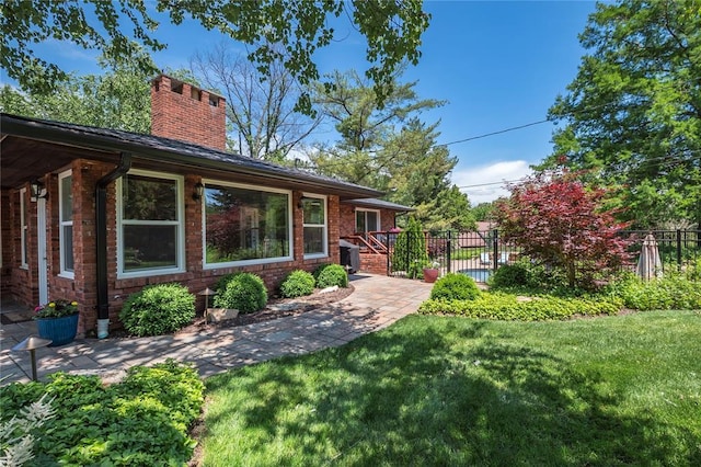 23 Vouga Ln, Frontenac, MO 63131 - view of front facade featuring a chimney and brick siding