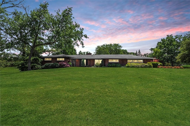 23 Vouga Ln, Frontenac, MO 63131 - ranch-style house with a lawn, a chimney, and brick siding