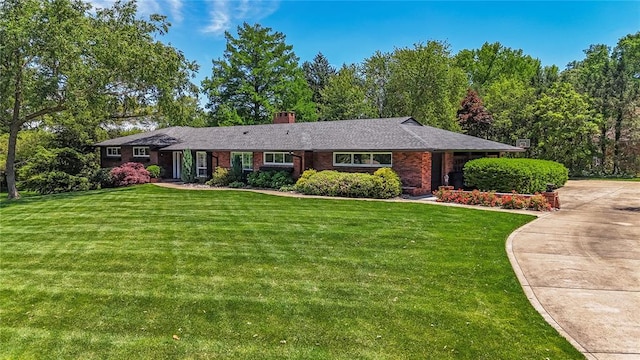 23 Vouga Ln, Frontenac, MO 63131 - single story home with a front yard, a chimney, brick siding, and driveway