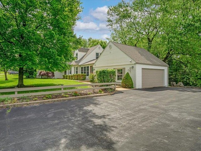 211 Country Club Ln, Belleville, IL 62223 - view of front of property with asphalt driveway, a garage, and a front yard