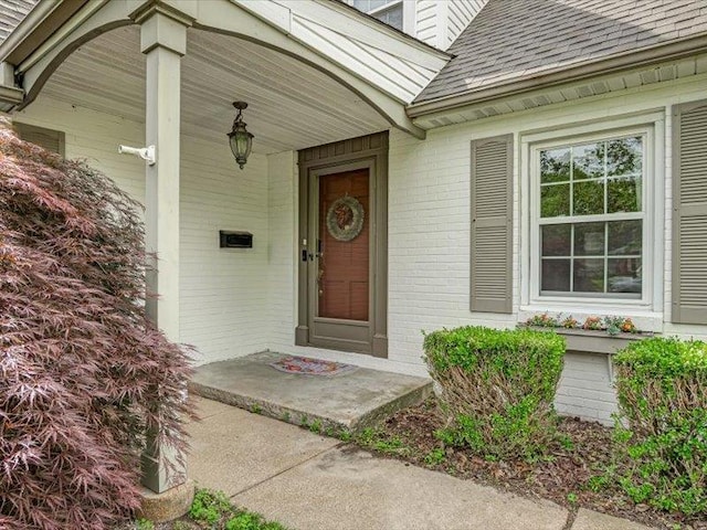 211 Country Club Ln, Belleville, IL 62223 - property entrance with a shingled roof and brick siding