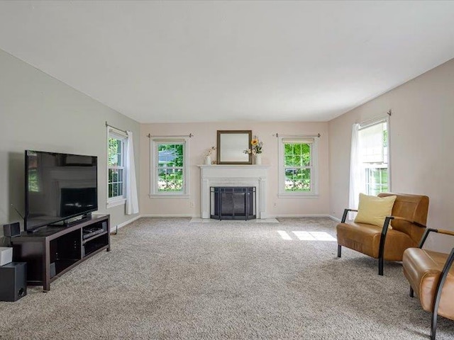 211 Country Club Ln, Belleville, IL 62223 - carpeted living room featuring a fireplace with flush hearth and baseboards