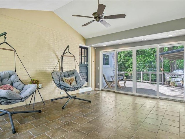 211 Country Club Ln, Belleville, IL 62223 - unfurnished room featuring brick wall, a ceiling fan, and high vaulted ceiling