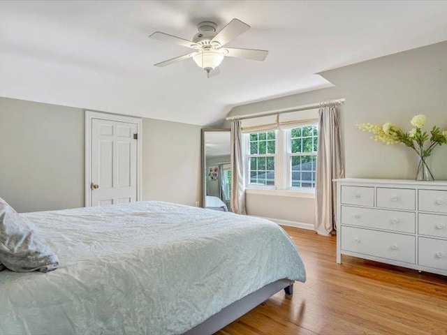 211 Country Club Ln, Belleville, IL 62223 - bedroom featuring lofted ceiling, wood finished floors, a ceiling fan, and baseboards
