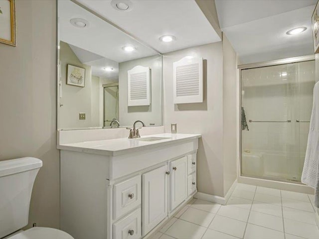 211 Country Club Ln, Belleville, IL 62223 - full bath featuring vanity, toilet, a shower stall, tile patterned flooring, and baseboards