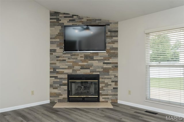403 Autumn Farms Ct, Wentzville, MO 63385 - detailed view of wood finished floors and a stone fireplace