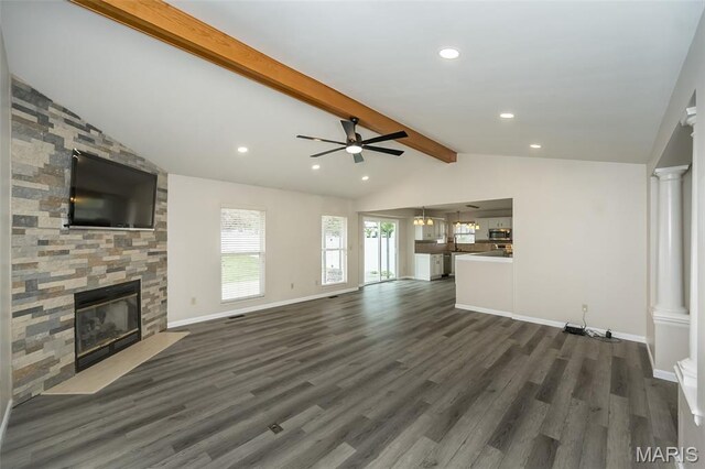 403 Autumn Farms Ct, Wentzville, MO 63385 - unfurnished living room featuring a stone fireplace, dark wood-type flooring, recessed lighting, ceiling fan, and decorative columns