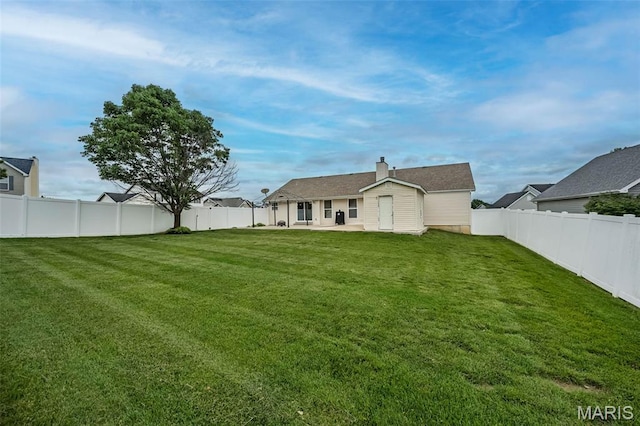 403 Autumn Farms Ct, Wentzville, MO 63385 - back of property with a patio, a fenced backyard, and a chimney